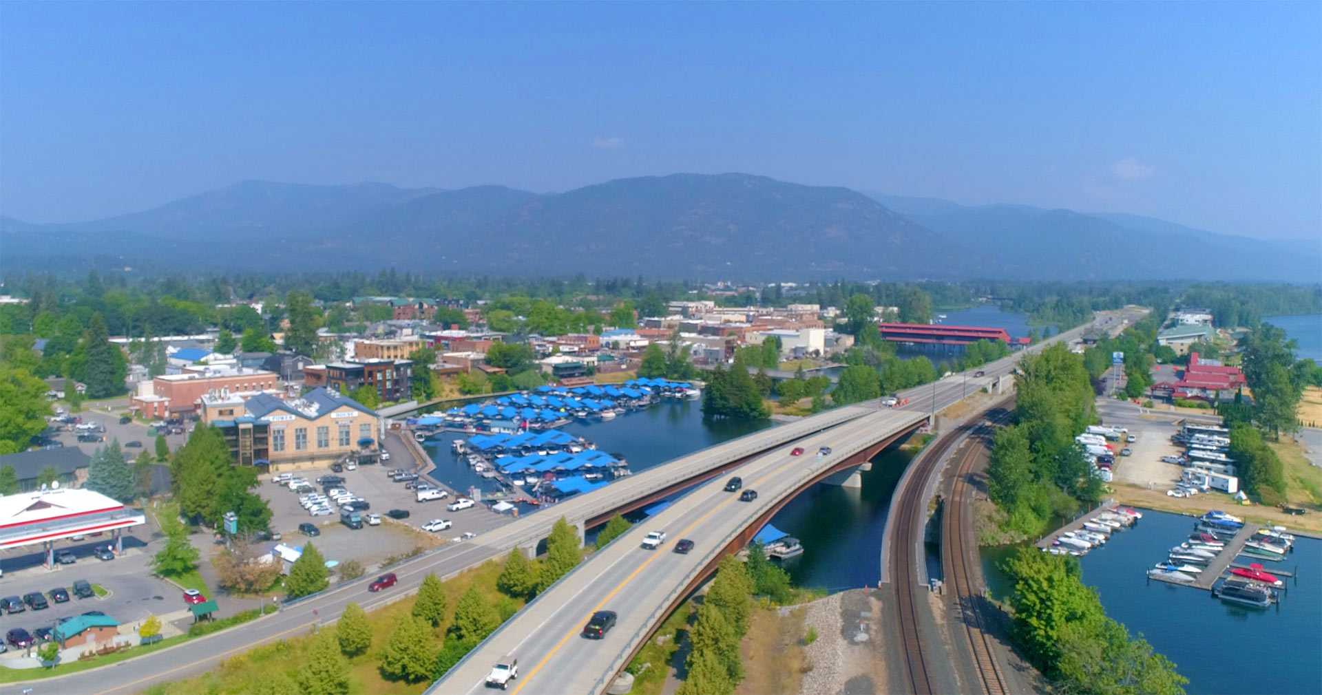 Aerial view of the Sandpoint bypass bridge, marina, and Cedar Street Bridge over Lake Pend Oreille